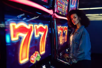A cheerful woman in traditional clothing using her smartphone during a festive moment, showing how easily the PANALO app fits into everyday life.
